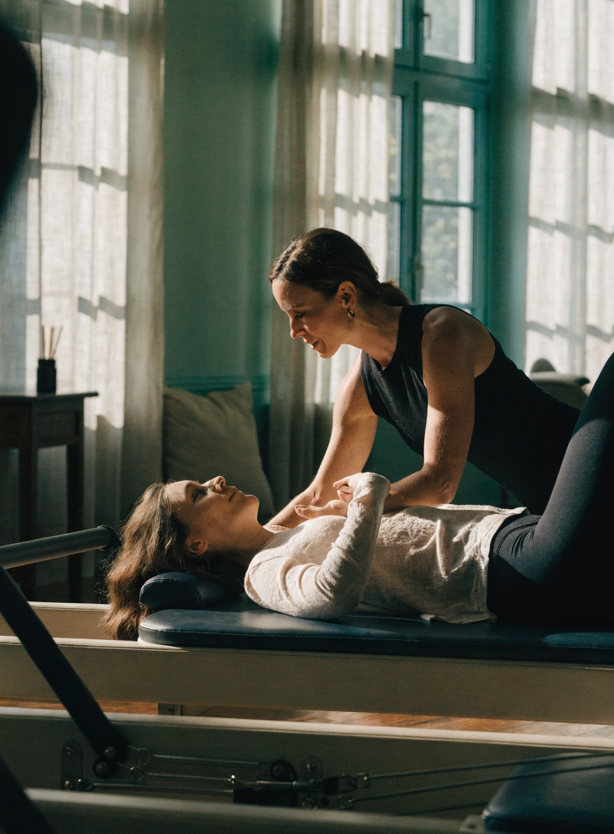 Pilates instructor teaching